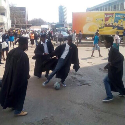 Graduates playing soccer