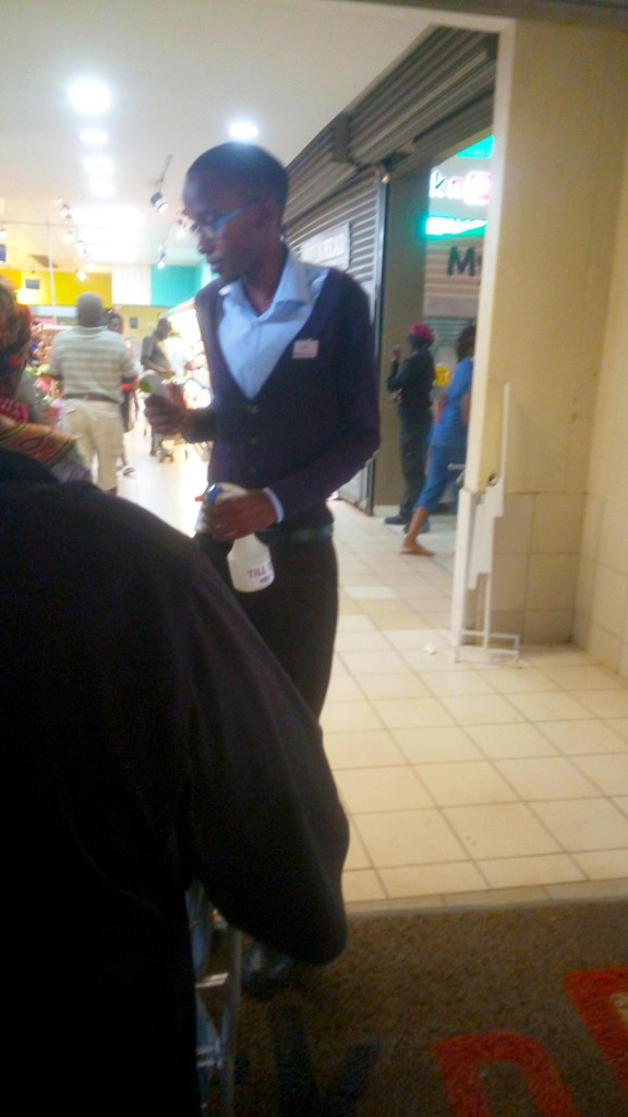 supermarket hand sanitizing station and temperature checking