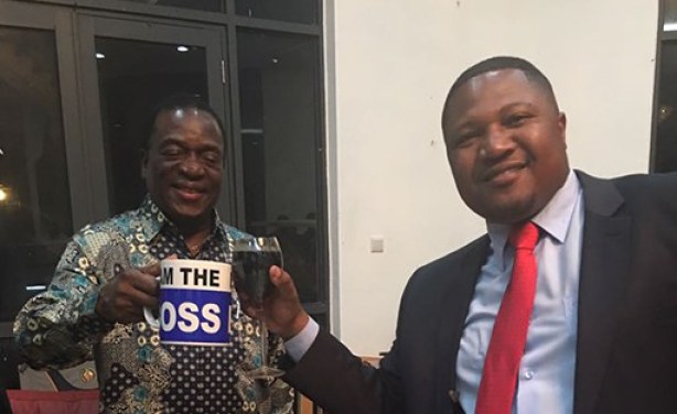 Mnangagwa holds boss mug