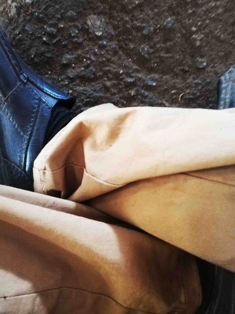 sitting cross legged at police station