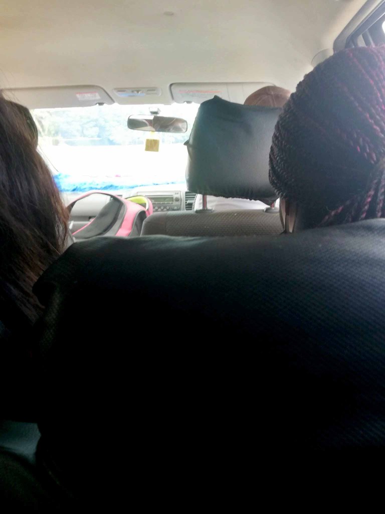 ride sharing passengers in a Toyota Wish pirate taxi