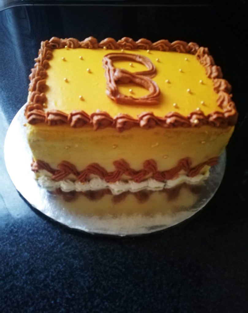 Cake with a B on it