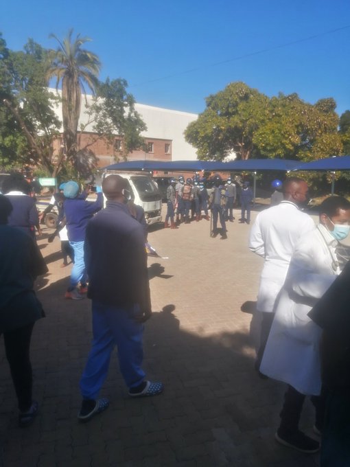 Riot Police monitoring health workers