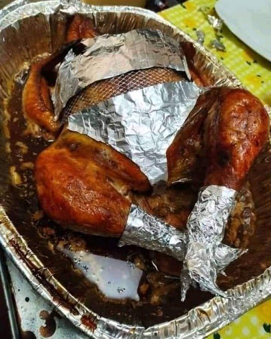 well dressed chicken in aluminium foil
