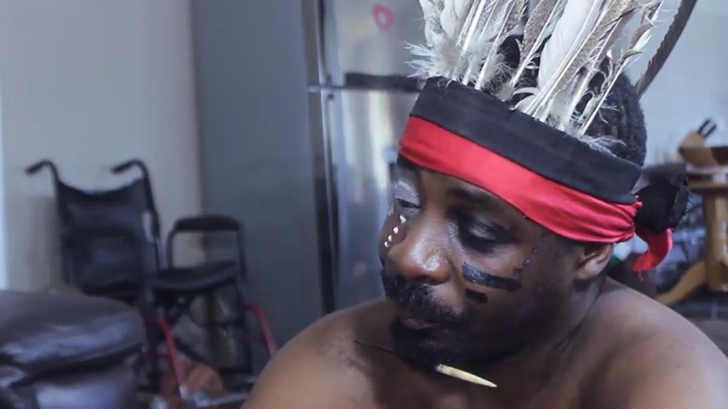 Ronald Gwindi as the n'anga in Nevanji