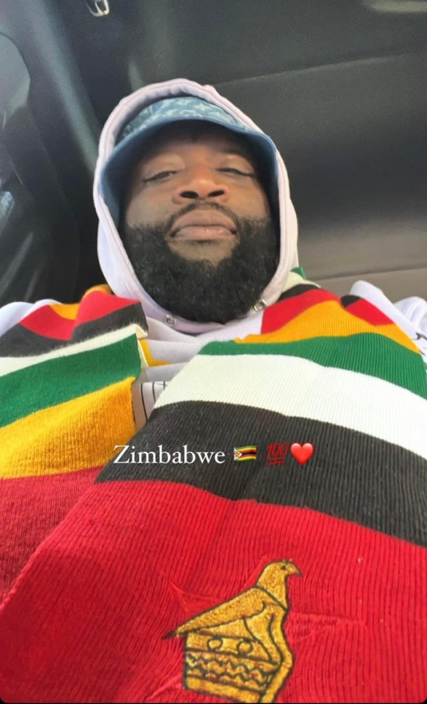Rick Ross wearing ZImbabwe Flag Scarf