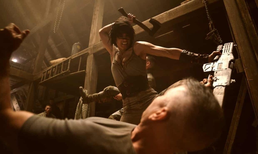 Kora wielding an axe in Rebel Moon