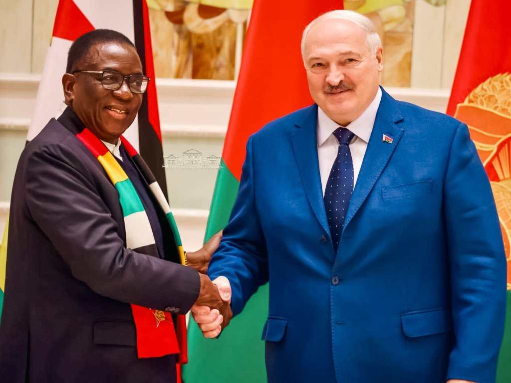 President of Zimbabwe shakes hands with President of Belarus