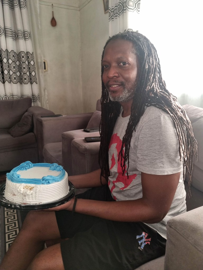 Uncle B Holding birthday cake 