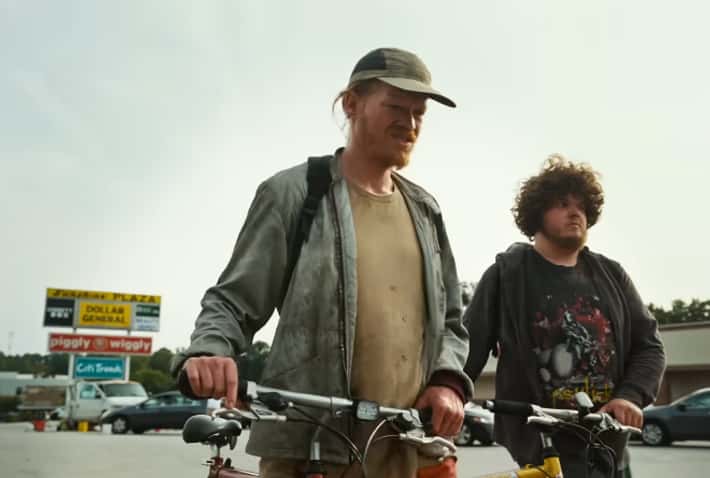 Jesse Plemons as Teddy Gatz and Aidan Delbis as Don in Bugonia